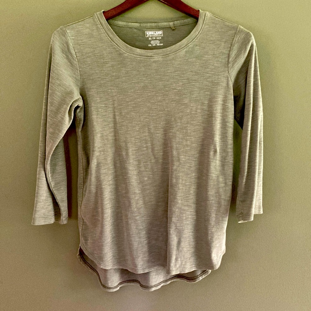 Brand new, never worn, soft mid long sleeve shirt with a slightly lower back.